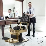 Vintage barber chair, black-gold